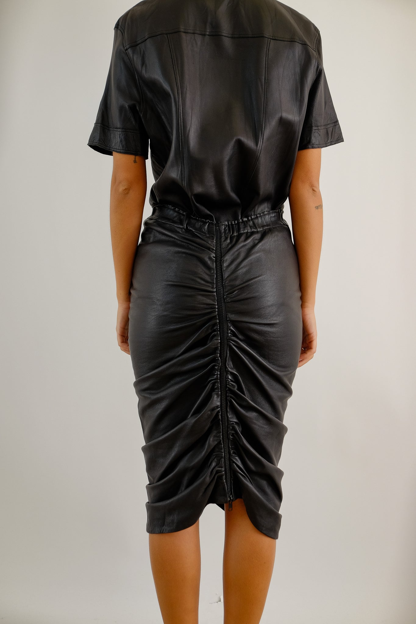 LEATHER RUCHED SKIRT IN BLACK