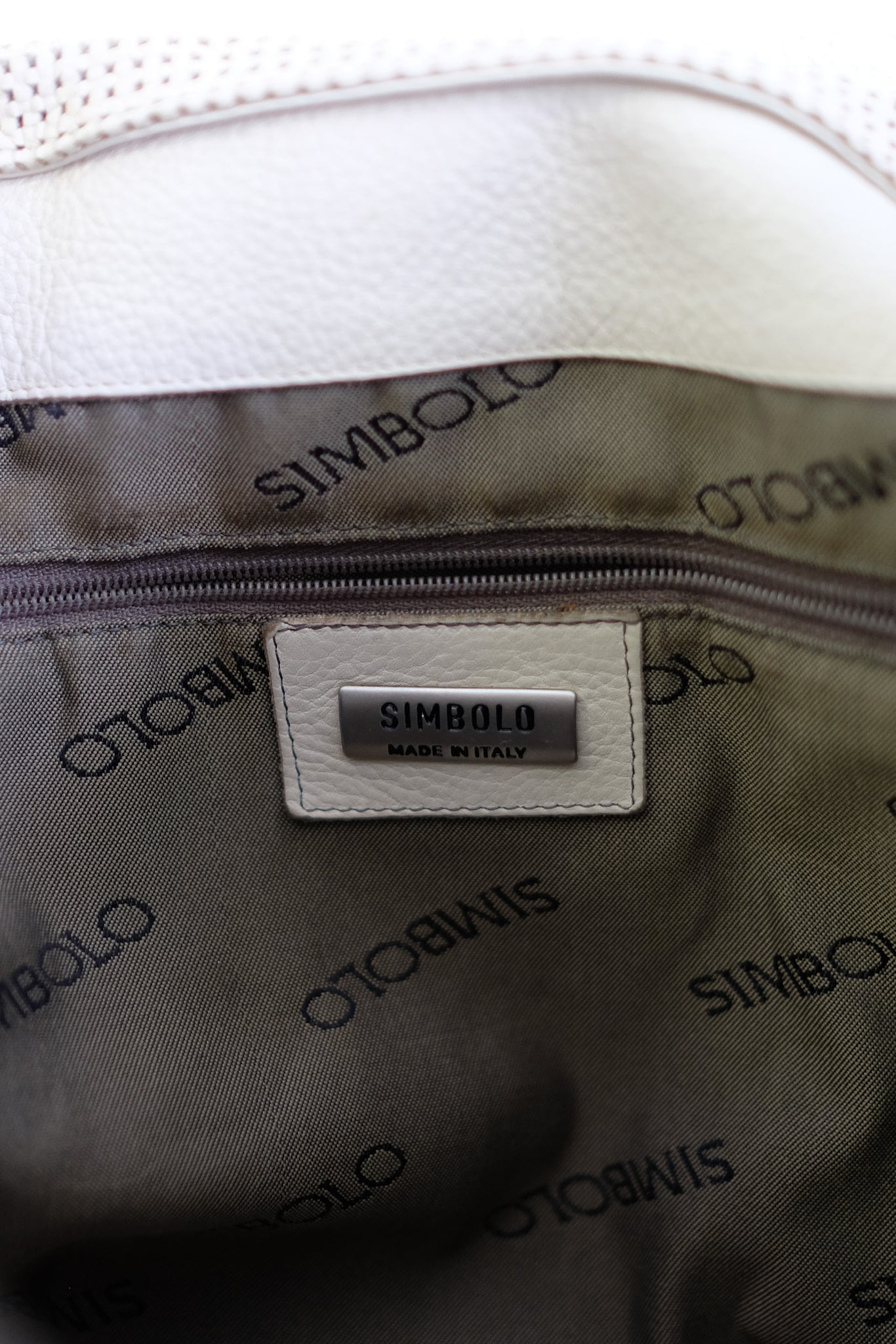 SIMBOLO PERFORATED LEATHER SHOULDER BAG IN OFF WHITE