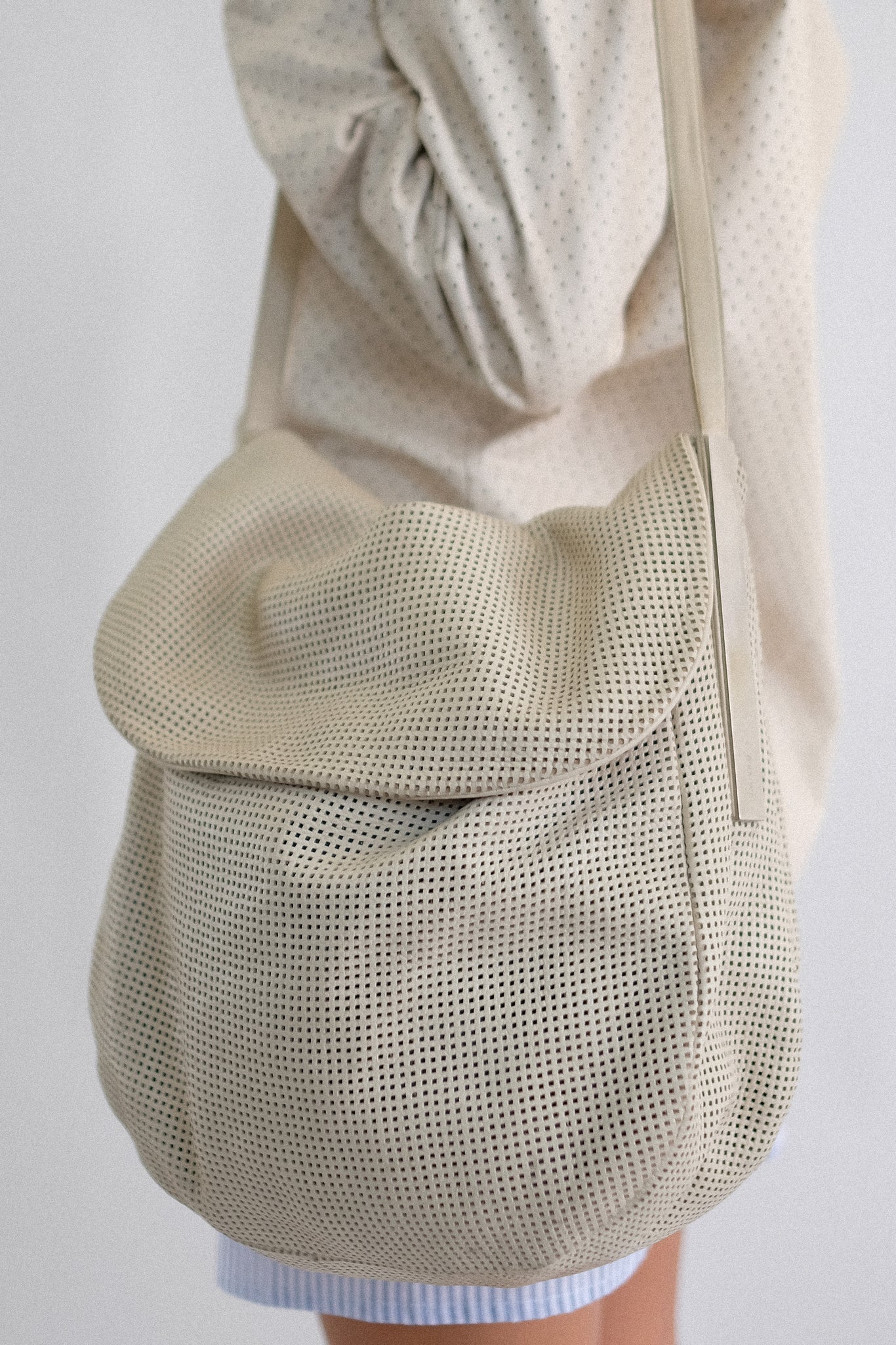 SIMBOLO PERFORATED LEATHER SHOULDER BAG IN OFF WHITE
