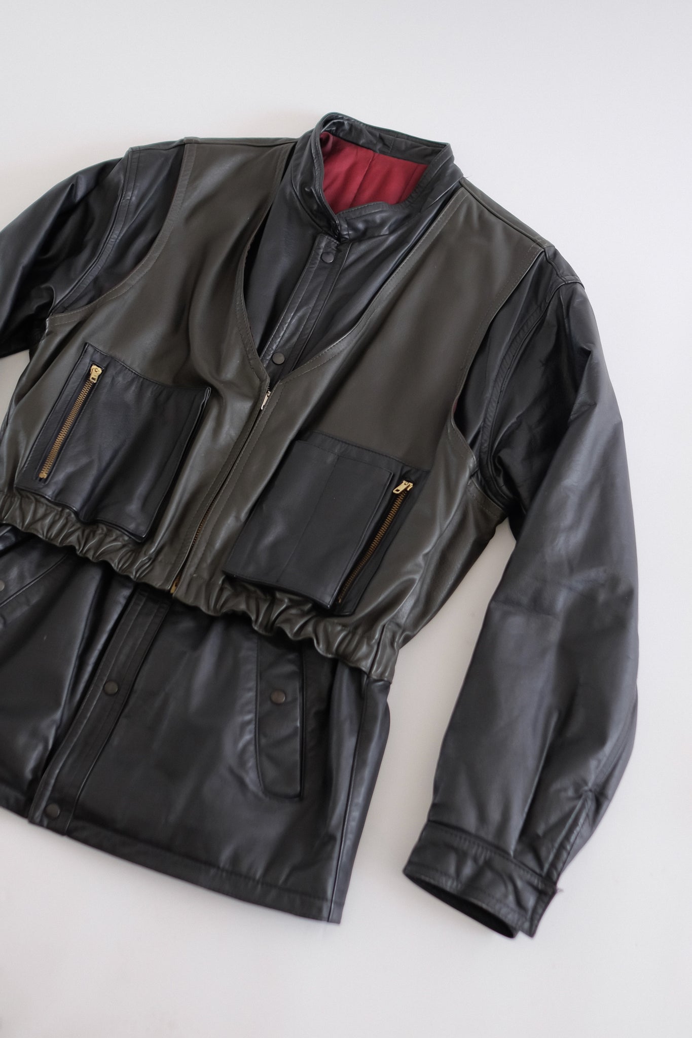 LEATHER DOUBLE VEST JACKET IN BLACK AND DARK OLIVE